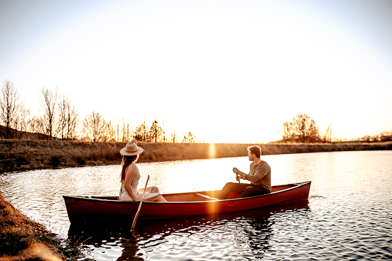 Couples photography, couple in a rowboat at sunset